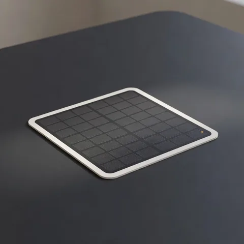 A FindStick on a dark surface catching daylight from a window.